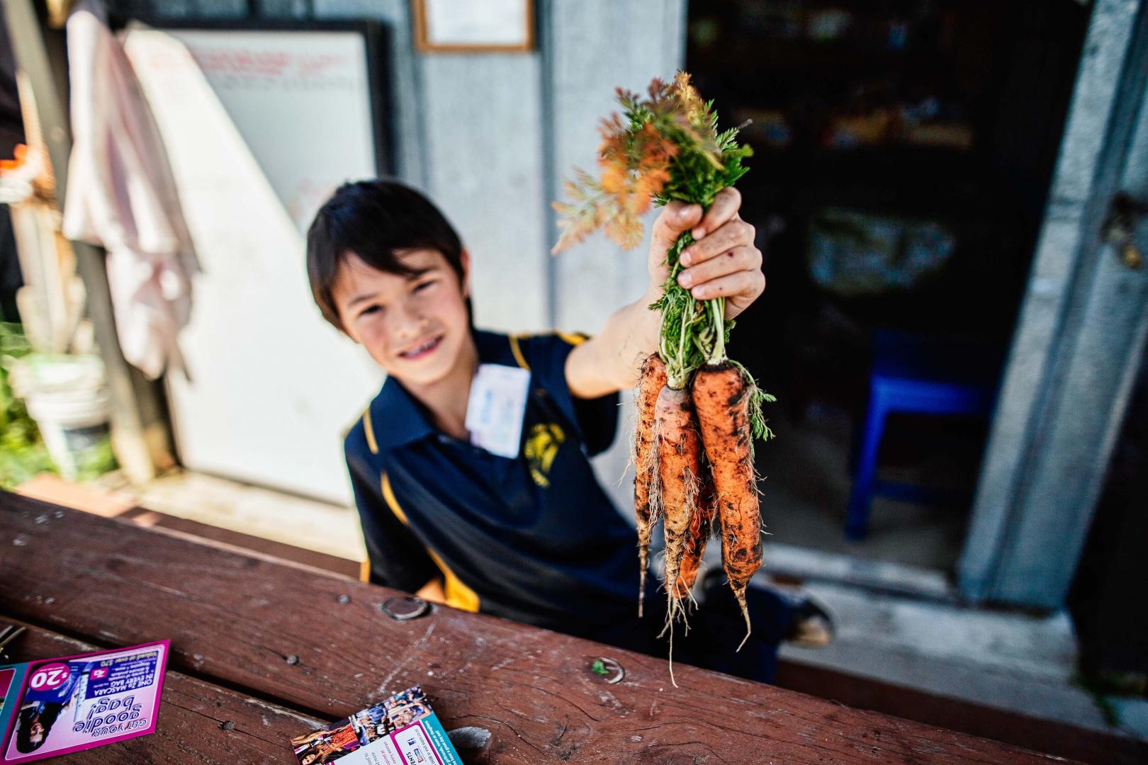 child and carrot